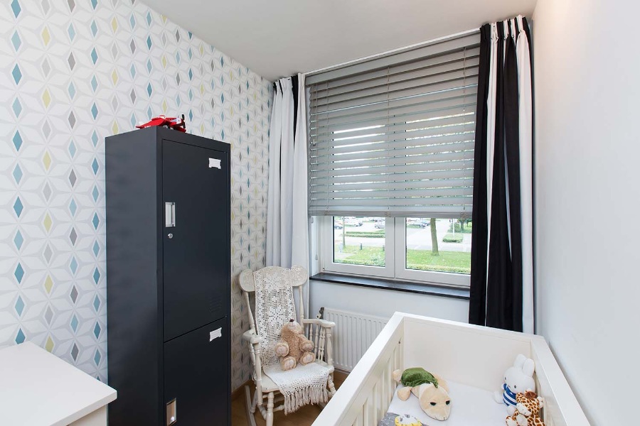 Slaapkamer kinderen met jaloezieën